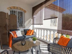 a balcony with a couch and a table at Villa Mys by Interhome in Miami Platja