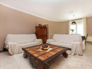 a living room with two couches and a coffee table at Villa Villa Mys by Interhome in Miami Platja +13 photos