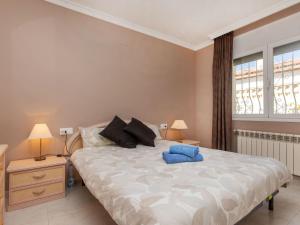 a bedroom with a large bed with two lamps at Villa Villa Mys by Interhome in Miami Platja