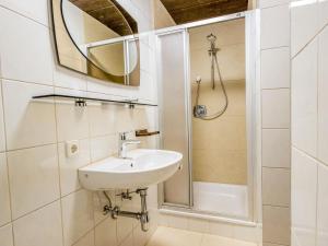 a bathroom with a sink and a shower at Studio Garten Appartement by Interhome in Innsbruck