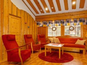 a living room with a couch and two chairs at Holiday Home Lauri 5 by Interhome in Sirkka