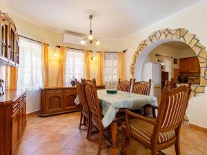 a kitchen with a table and chairs in a room at Holiday Home Tamas by Interhome in Balatonőszöd