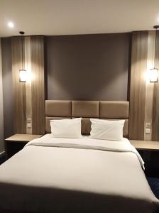 Ένα ή περισσότερα κρεβάτια σε δωμάτιο στο Golden House Dammam +21 φωτογραφίες