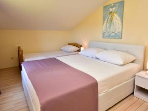 Postel nebo postele na pokoji v ubytování Apartment Melandura-10 by Interhome
