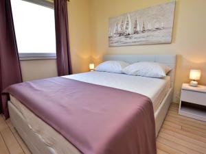 Postel nebo postele na pokoji v ubytování Apartment Melandura-10 by Interhome