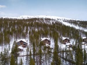 an aerial view of a resort with snow covered trees at Holiday Home Karhunkieppi 9b- 2 skipasses included by Interhome in Levi