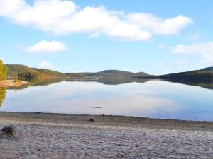 a view of a lake with mountains in the background at Holiday Home Solokoto by Interhome in Inari