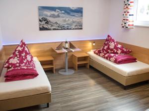a hospital room with two beds and a table at Apartment Bella Monte-4 by Interhome in Pettneu am Arlberg