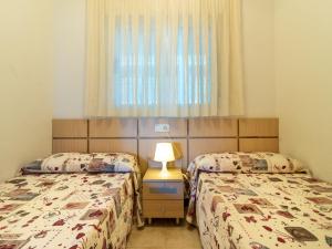 Postel nebo postele na pokoji v ubytování Apartment Jardines del Mar III - Marina d'Or-2 by Interhome