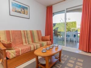 a living room with a couch and a table at Apartment Residencial Eurosol de los Monteros by Interhome in Miami Platja