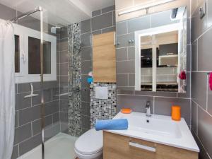 a bathroom with a sink and a toilet and a shower at Apartment Naranja by Interhome in Tossa de Mar