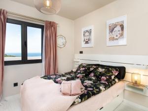 Postel nebo postele na pokoji v ubytování Holiday Home Melon by Interhome
