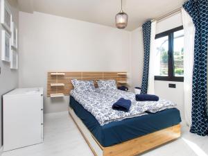 Postel nebo postele na pokoji v ubytování Holiday Home Melon by Interhome