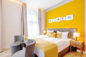 Postel nebo postele na pokoji v ubytování SEETELHOTEL Ostseehotel das Entdeckerhotel an der Ostsee und der perfekte Startpunkt für Ihre Inselabenteuer