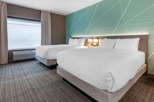 Postel nebo postele na pokoji v ubytování Comfort Suites Cottage Grove-Madison + 20 fotografií