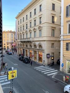 an empty city street with a large building at Casa Leoncino B&B in Rome