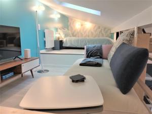 TV a/nebo společenská místnost v ubytování La Mezzanine par Picardie Homes