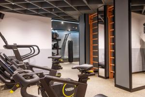 a gym with treadmills and elliptical machines at Middle Eight - Covent Garden - Preferred Hotels and Resorts in London