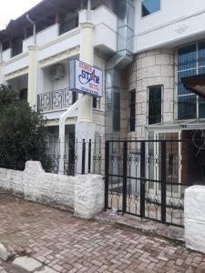 a building with a sign in front of it at KEMER STAR HOTEL in Kemer