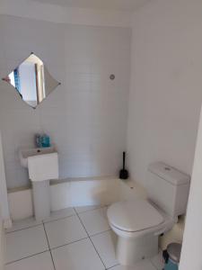 a white bathroom with a toilet and a sink at Cornhill Apartment by Serviced Living Liverpool in Liverpool