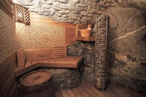 a sauna with a wooden bench and a ladder at Divina Vita Apartments in Varenna +57 photos