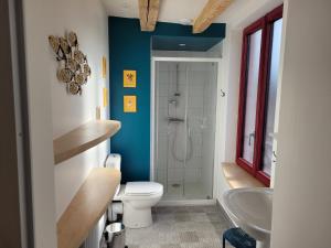 a bathroom with a toilet and a sink and a shower at Bulle de campagne à Saint Benoit la Forêt in Saint-Benoît-la-Forêt +75 photos