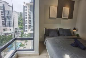 a bedroom with a bed and a large window at Vest Home@Midhill Genting Highlands(Free WiFi) in Bentong +46 photos