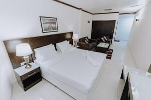 Postel nebo postele na pokoji v ubytování Panorama Hotel Deira + 33 fotografií