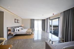 A bed or beds in a room at Ramada Resort by Wyndham Bodrum