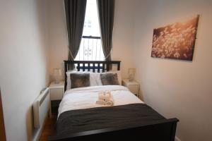 A bed or beds in a room at The Holkham