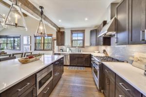 a kitchen with wooden cabinets and a counter top at Cocoa Cabin home in Breckenridge