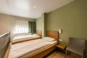 Katil atau katil-katil dalam bilik di Hotel Miķelis