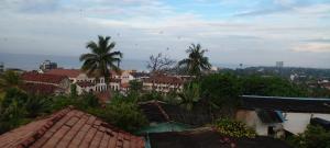 a view of a city with palm trees and buildings at Galle City Nest in Galle