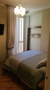 A bed or beds in a room at Al Molo di Sant'Agostino