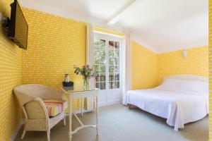 Ein Bett oder Betten in einem Zimmer der Unterkunft Hotel Les Goelands