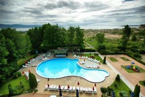 an overhead view of a swimming pool with chairs and umbrellas at Sirena Hotel- ALL INCLUSIVE in Sunny Beach