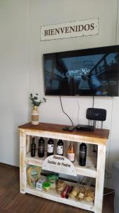 a tv sitting on top of a table with food at Casita de Piedra 6 in Trinidad