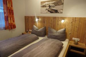a bedroom with two beds with pillows at Apartment Kolb in Hippach