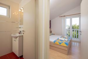 Koupelna v ubytování Apartmani Kaštelančić