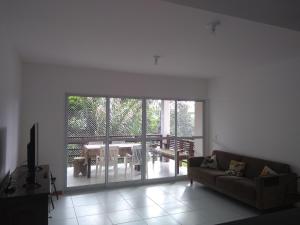 a living room with a couch and a table at IMBASSAI... UM PARAISO ESPERANDO POR VOCE in Mata de Sao Joao