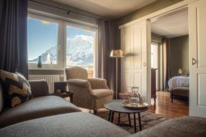 a hotel room with a view of a mountain at Boutique Hotel Bellevue Lermoos in Lermoos