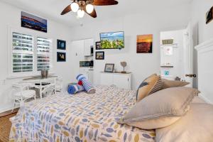a bedroom with a bed and a painting on the wall at Island Bay Resort in Key Largo