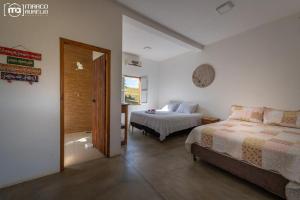 מיטה או מיטות בחדר ב-Chale Cantinho de Minas