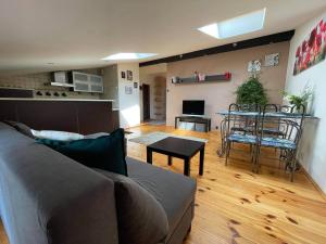 a living room with a couch and a table at Apartament Studio Nałęczów in Nałęczów