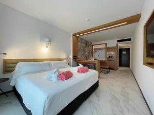 Łóżko lub łóżka w pokoju w obiekcie Stic Urban Hotel & SPA
