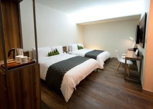 Postel nebo postele na pokoji v ubytování Metro Hotel Myeongdong