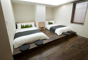 Postel nebo postele na pokoji v ubytování Metro Hotel Myeongdong