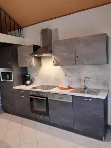 Kuchyň nebo kuchyňský kout v ubytování Ferienhaus am Weserberglandsee + 24 fotografií