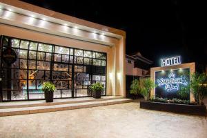 a store front with potted plants in front of it at Hotel Vanguardia Natural in Villavicencio