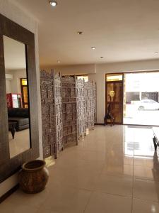 a lobby with a large mirror in a building at Hotel La Vista 32 in Punta del Este +54 photos